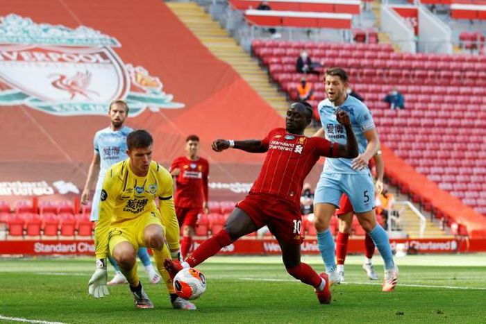 Burnley goalkeeper Nick Pope (left) kept Liverpool at bay