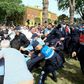 Dozens of opposition supporters, activists and actors battled with police as they tried to break through a security cordon