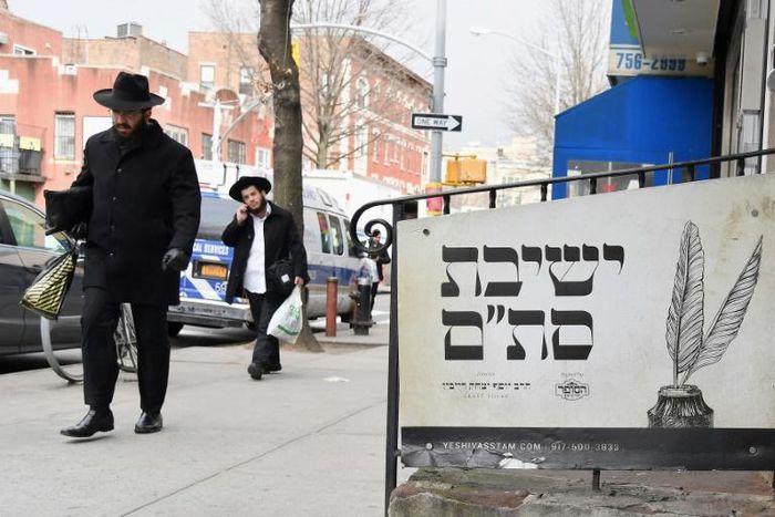 (FILES) In this file photo Orthodox Jewish men walk in the Brooklyn neighborhood of Crown Heights on February 27, 2019 in New York. The United States saw a record number of anti-Semitic incidents last year, including a sharp spike in physical attacks, ...