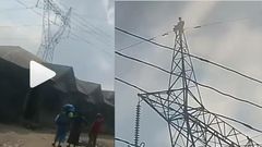 Pastor climbs high tension electricity pole and threatens to jump to death (video)