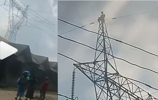 Pastor climbs high tension electricity pole and threatens to jump to death (video)