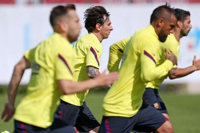 Ready for action: Lionel Messi and his Barcelona teammates are back in training