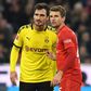Bayern Munich striker Thomas Mueller (R) says he welcomes the challenge issued by Borussia Dortmund captain Mats Hummels (L) for next season.
