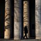A guard walks past the columns of a memorial in Berlin that will figure in VE day ceremonies