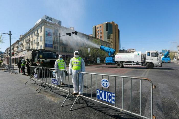 Mondolia health workers and police wear hazmat suits during a coronavirus drill in the capital, Ulaanbaatar