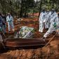 Employees bury the coffin of a person who died from COVID-19 at the Vila Formosa cemetery, in the outskirts of Sao Paulo, Brazil on May 20, 2020