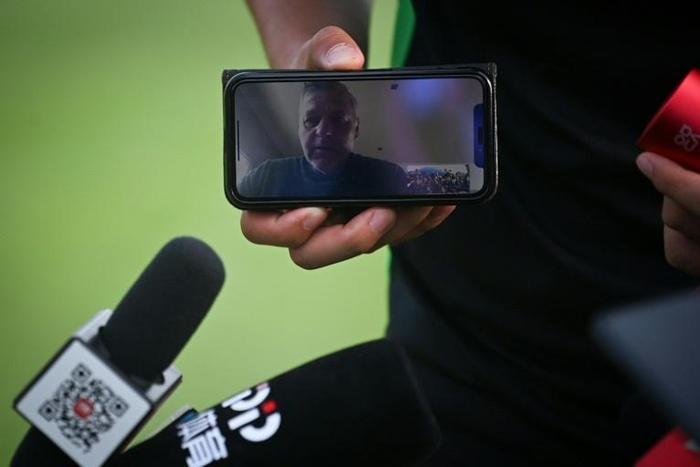 Beijing Guoan’s head coach Bruno Genesio speaks from France