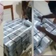 Video shows bundles of gh¢100 and gh¢200 cash being offloaded into unknown house