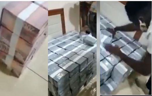 Video shows bundles of gh¢100 and gh¢200 cash being offloaded into unknown house