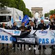 Several dozen police blocked traffic in a wildcat march down the Champs-Elysees avenue in Paris, carrying a banner proclaiming: "No police, no peace!"