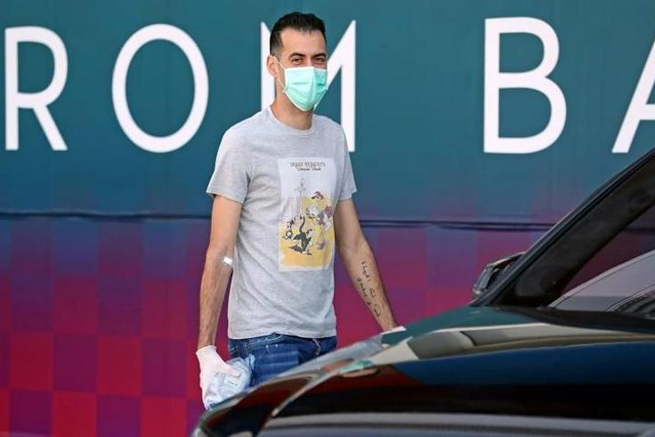 Barcelona's Sergio Busquets wearing a face mask and gloves on arrival at the club's training ground last week