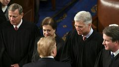 US Supreme Court Justice Neil Gorsuch (2R, pictured February 2019 shaking hands with President Donald Trump) wrote the majority opinion banning employers from firing LGBT workers on the basis of their sexual orientation