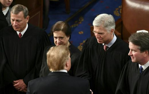 US Supreme Court Justice Neil Gorsuch (2R, pictured February 2019 shaking hands with President Donald Trump) wrote the majority opinion banning employers from firing LGBT workers on the basis of their sexual orientation
