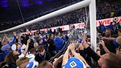 Wild stadium invasion leaves 25 fans seriously injured after police clash (Video)
