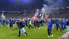 Wild stadium invasion and police clash leaves 25 fans seriously injured