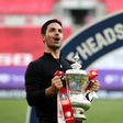 Arsenal boss Mikel Arteta holds the FA Cup trophy
