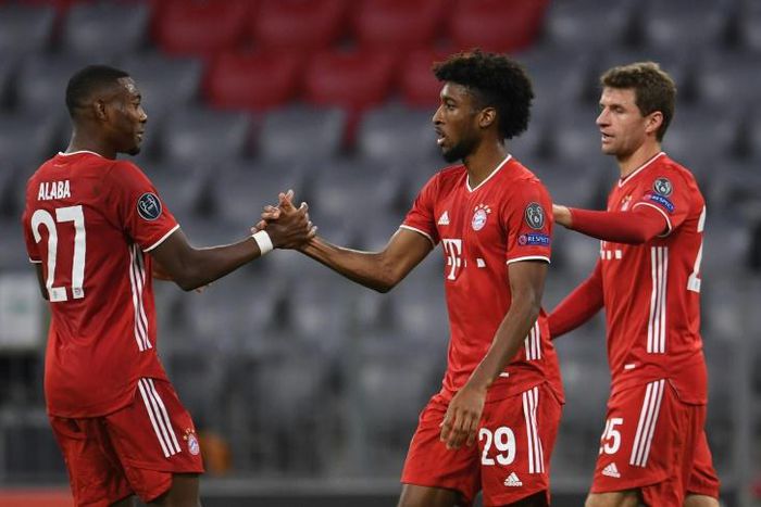 Kingsley Coman (C) celebrates scoring the opening goal in Bayern Munich's 2-0 win over Atletico Madrid