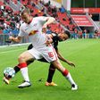 RB Leipzig's Germany defender Lukas Klostermann (L) will undergo keyhole surgery for a knee injury on Wednesday