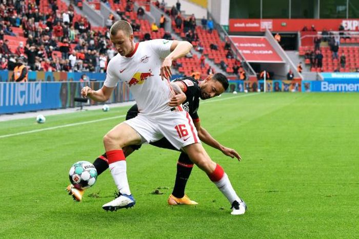 RB Leipzig's Germany defender Lukas Klostermann (L) will undergo keyhole surgery for a knee injury on Wednesday
