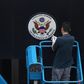 A worker removes the Great Seal of the United States from the front of the US consulate in the Chinese city of Chengdu