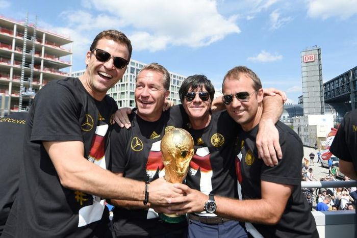 Hansi Flick (R) was assistant to head coach Joachim Loew (second from right) when Germany won the 2014 World Cup.