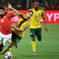 Liverpool and Egypt star Mohamed Salah (L) and Dean Furman of South Africa battle for possession during a 2019 Africa Cup of Nations last-16 clash in Cairo.