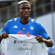 Napoli forward Victor Osimhen holds up a t-shirt 'End police brutality in Nigeria'.
