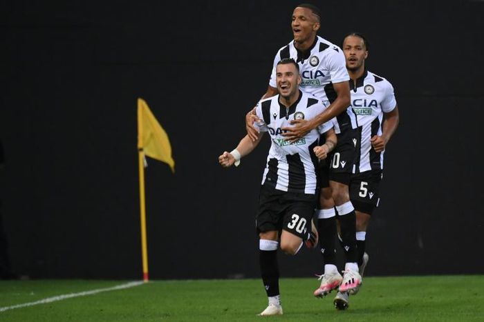 Udinese's Macedonian forward Ilija Nestorovski (L) celebrates after scoring against Juventus.