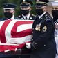 The flag-draped casket of civil rights icon John Lewis is carried by an honor guard to lie in state in the Capitol rotunda