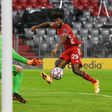 Kingsley Coman (R) scores Bayern Munich's final goal in a 4-0 thumping of Atletico Madrid