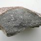 A piece of the meteorite Sahara 97096 (about 10 cm long), an enstatite chondrite