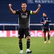 Houssem Aouar celebrates at the end of Lyon's Champions League quarter-final victory over Manchester City in Lisbon