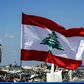 A Lebanese flag flies on a bridge near the port of Lebanon's capital Beirut, amid the destruction of Tuesday's explosion that killed over 150