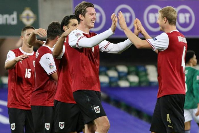 Austria striker Michael Gregoritsch (C) celebrates