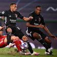 Lyon defender Fernando Marcal (C) battles with Robert Lewandowski in the Champions League semi-final against Bayern Munich