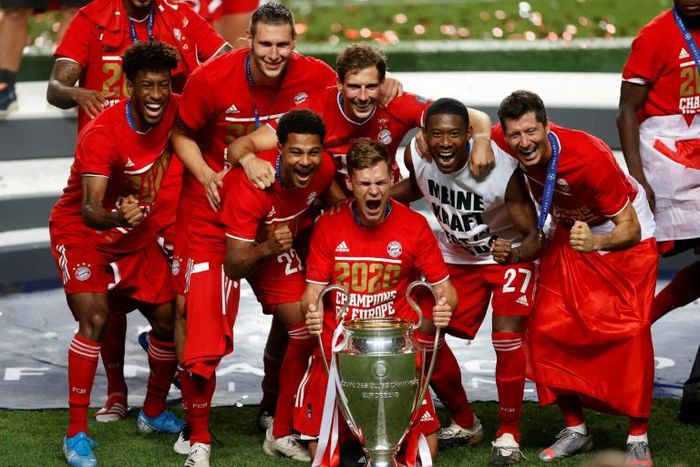 Joshua Kimmich (holding trophy) celebrates with his Bayern Munich team-mates after winning Sunday's Champions League final in Lisbon.
