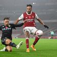 Arsenal forward Pierre-Emerick Aubameyang (R) is thwarted by Aston Villa defender Matty Cash during an English Premier League match in London Sunday.