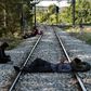 Migrants wait for a train to take them from Idomeni to a new life