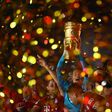Manuel Neuer raises the German Cup trophy after Bayern Munich beat Bayer Leverkusen in last season's final in July