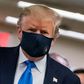 President Donald Trump makes a rare appearance in a mask as part of a new attempt to restore his standing with Americans over the handling of the coronavirus pandemic