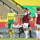 Referee Kevin Friend shows a red card to Norwich's Josip Drmic