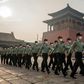 People's Liberation Army (PLA) soldiers march next to the entrance to the Forbidden City in Beijing
