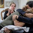 (L to R) Rita Hitti (mother of 27-year-old missing fireman Najib) and her daughter Carlyn (wife of 37-year-old missing fireman Charbel Karam) cry as they comfort each other at their home in the mountain town of Qartaba, north of the Lebanese capital