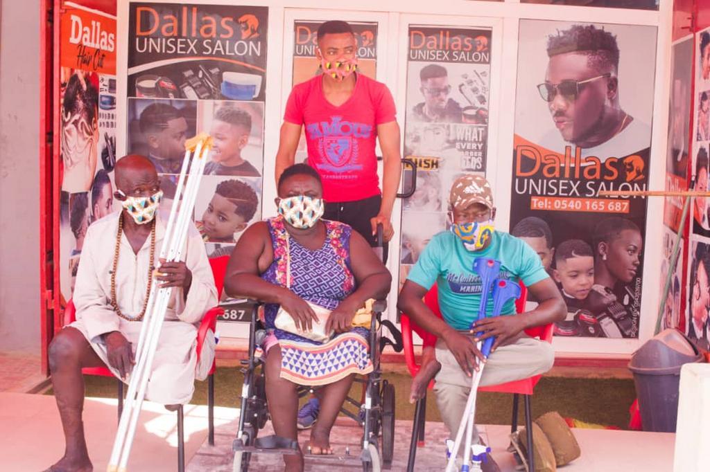 Ghanaian policeman gives to the physically challenged