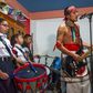 Victor Hugo Sandoval (R), vocalist and guitarist of Mexican rock band Los Cogelones, rehearses with his students -- members of a marching band -- in Ciudad Nezahualcoyotl, Mexico state, Mexico, on August 12, 2020