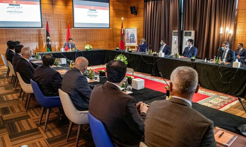 Morocco's Foreign Minister Nasser Bourita chairs a meeting of representatives of Libya's rival administrations in the coastal town of Bouznika, south of Rabat