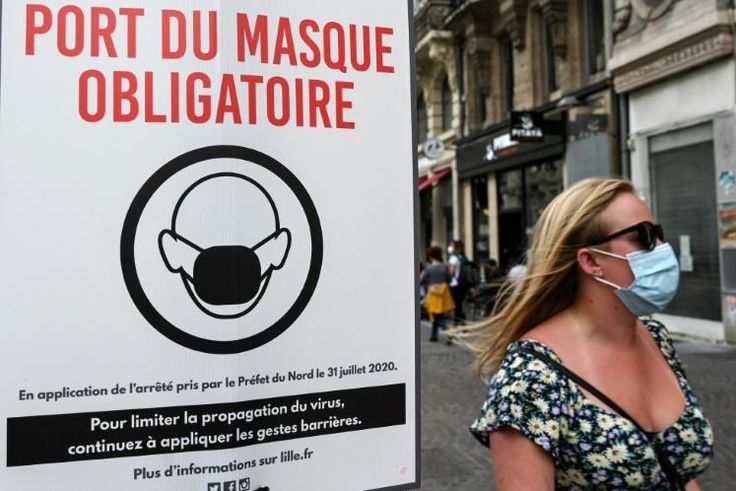 A sign warns passersby that masks are mandatory in Lille, northern France in August 2020