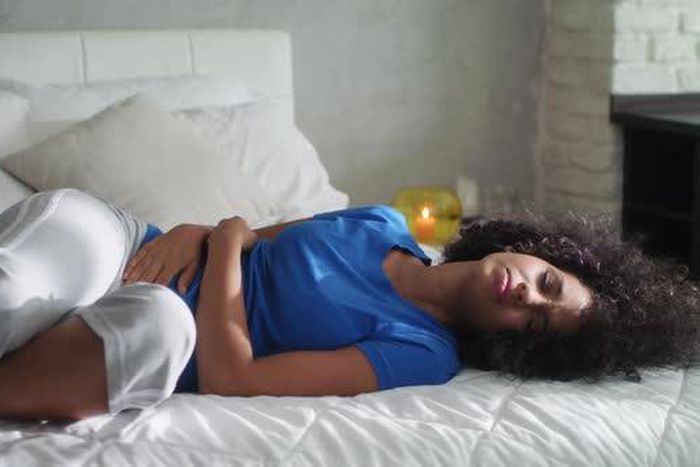 Lady suffering from mentrual cramps