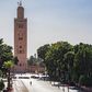 A few people walk by next to the Kutubiyya mosque's minaret tower at the Jemaa el-Fna square in the Moroccan city of Marrakesh on September 8, 2020, currently empty of its usual crowds due to the COVID-19 pandemic