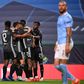 Lyon players celebrate after Moussa Dembele's second goal which sealed their 3-1 win over Manchester City in the Champions League quarter-finals in Lisbon on Saturday